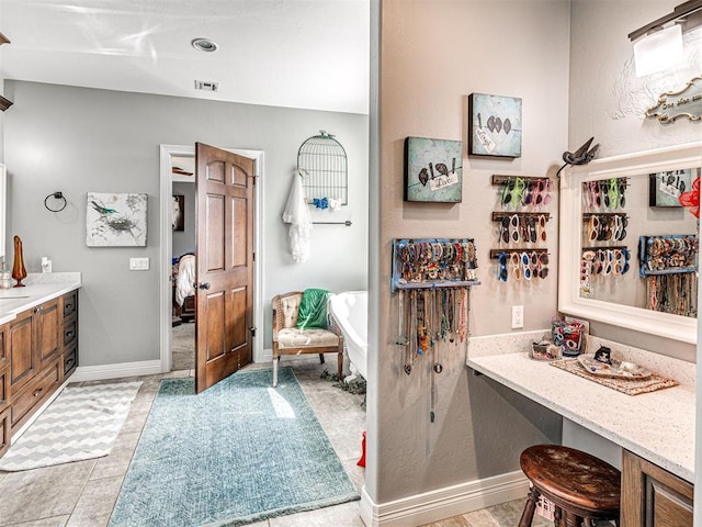 344750 E 830th Rd, Chandler, OK 74834 - bathroom featuring a soaking tub, vanity, and baseboards