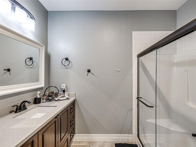 344750 E 830th Rd, Chandler, OK 74834 - bathroom featuring a stall shower, baseboards, and vanity
