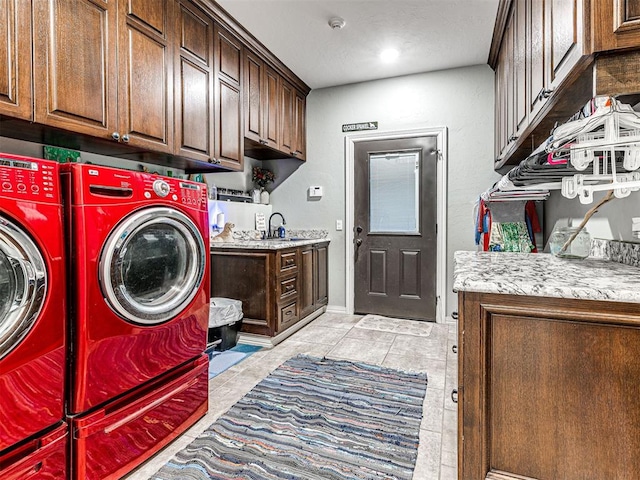344750 E 830th Rd, Chandler, OK 74834 - laundry area featuring cabinet space, washing machine and clothes dryer, and light tile patterned floors