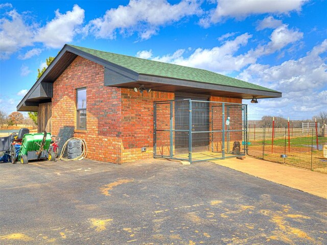 344750 E 830th Rd, Chandler, OK 74834 - back of property with brick siding and a shingled roof