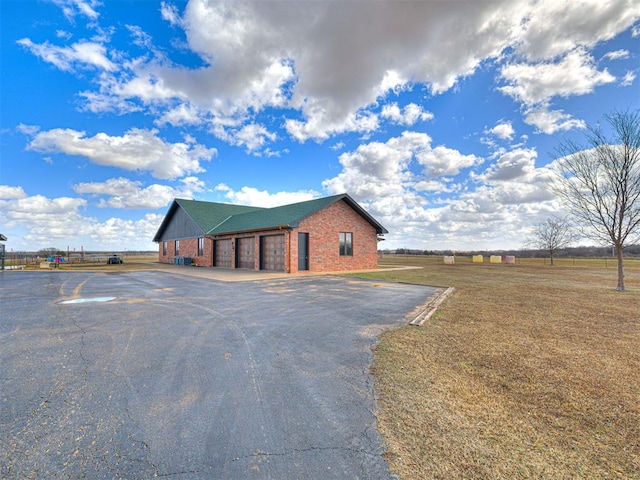344750 E 830th Rd, Chandler, OK 74834 - view of building exterior with driveway and a garage