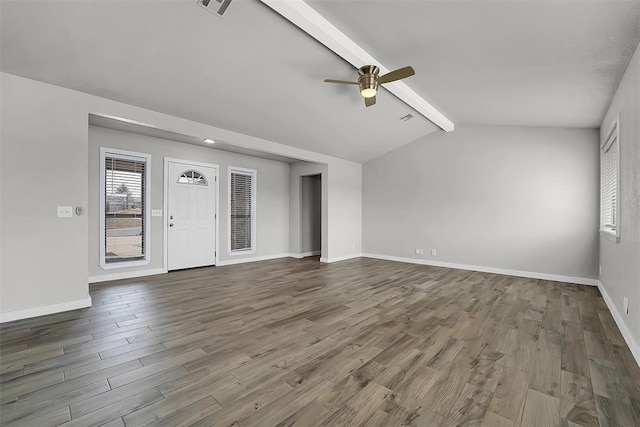 unfurnished living room featuring ceiling fan, vaulted ceiling with beams, baseboards, and wood finished floors