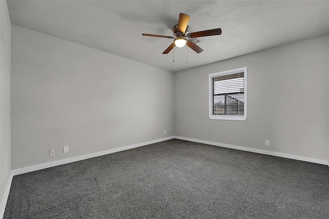 carpeted spare room featuring ceiling fan, baseboards, and a textured ceiling