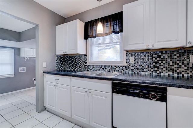 kitchen with a sink, white cabinetry, backsplash, dishwasher, and dark countertops