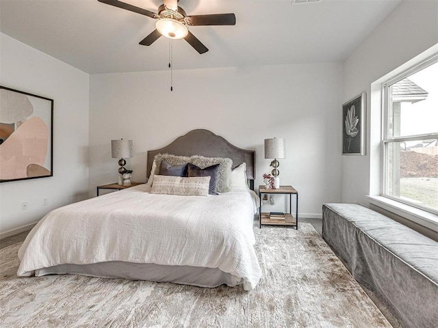 carpeted bedroom featuring visible vents, ceiling fan, and baseboards