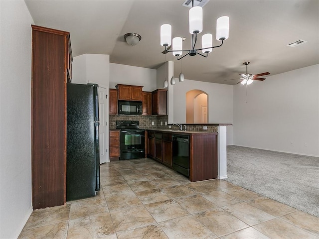 kitchen featuring black appliances, visible vents, open floor plan, and backsplash