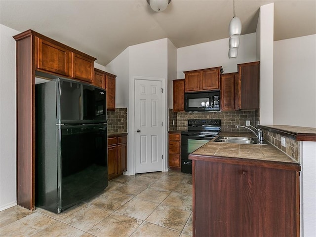 kitchen with tasteful backsplash, a peninsula, hanging light fixtures, black appliances, and a sink