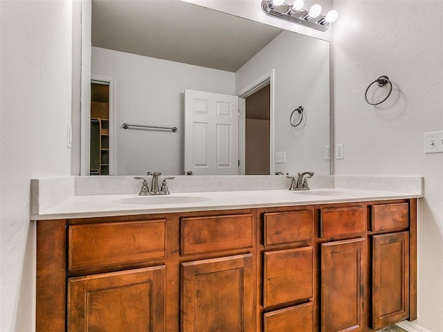 bathroom with double vanity and a sink