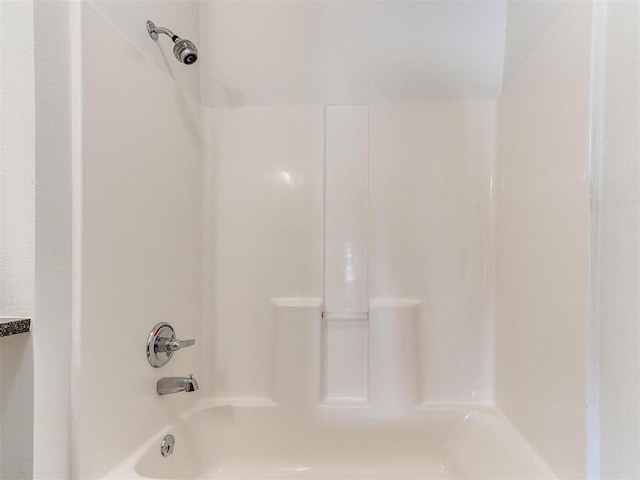 bathroom with shower / washtub combination