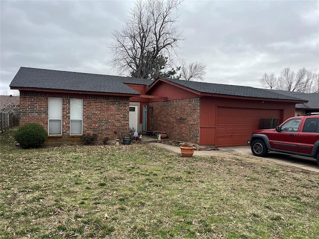 view of front of property with a front yard, brick siding, an attached garage, and roof with shingles