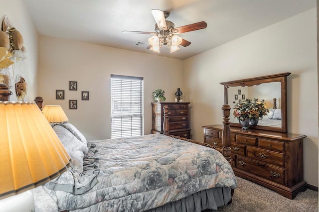 bedroom featuring carpet floors, visible vents, and ceiling fan