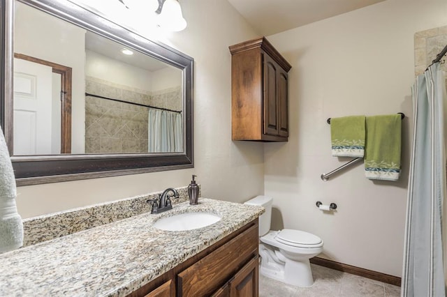 bathroom featuring baseboards, a shower with shower curtain, toilet, tile patterned flooring, and vanity