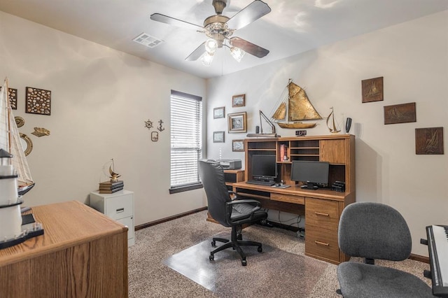 office area with carpet floors, baseboards, visible vents, and a ceiling fan