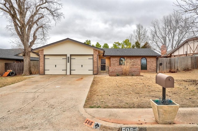 view of front of property featuring a shingled roof, concrete driveway, an attached garage, fence, and brick siding