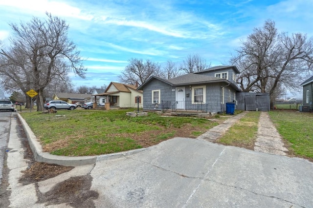 exterior space with driveway and a front lawn