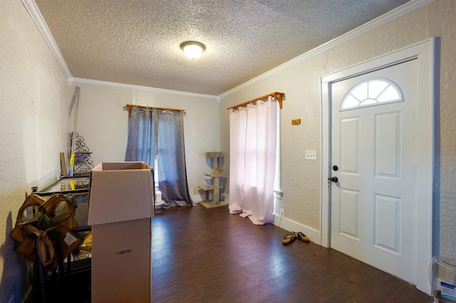 entrance foyer featuring a textured ceiling, ornamental molding, wood finished floors, and a textured wall