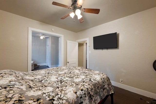 bedroom with dark wood-type flooring, ceiling fan, and baseboards