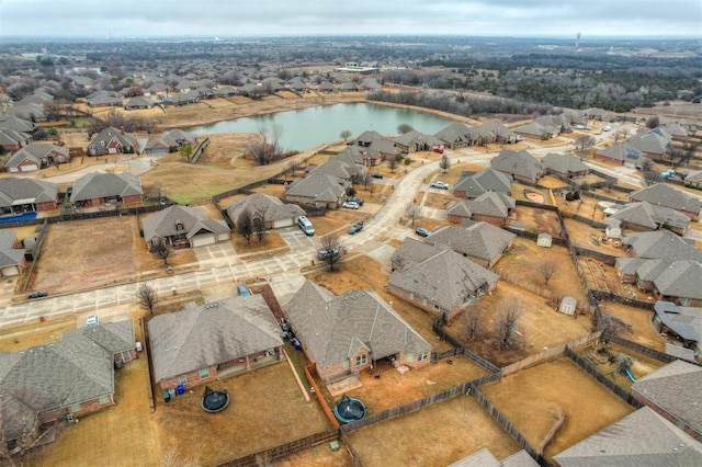 aerial view featuring a water view and a residential view