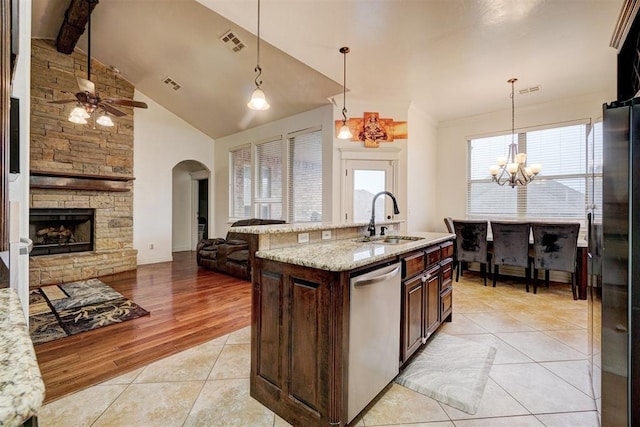 kitchen featuring stainless steel appliances, visible vents, a sink, and light tile patterned floors