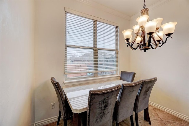 dining room featuring light tile patterned flooring, crown molding, baseboards, and an inviting chandelier