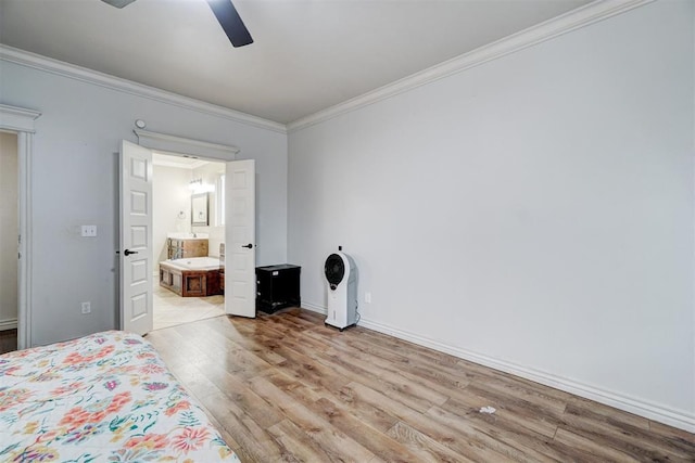 bedroom featuring ensuite bathroom, ceiling fan, baseboards, light wood finished floors, and crown molding