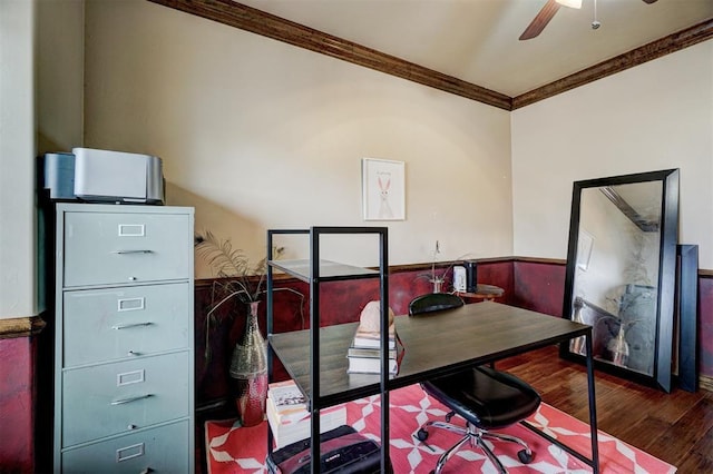 office with a wainscoted wall, wood finished floors, a ceiling fan, and crown molding