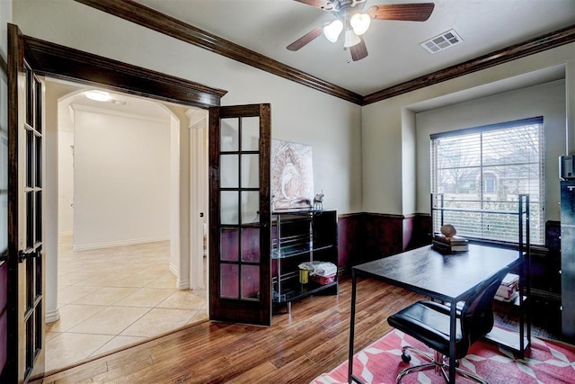 office area with ceiling fan, visible vents, crown molding, and wood finished floors