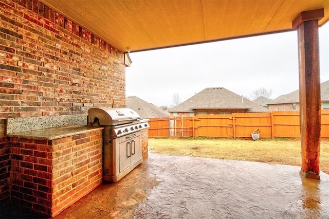 view of patio / terrace with grilling area, area for grilling, and fence