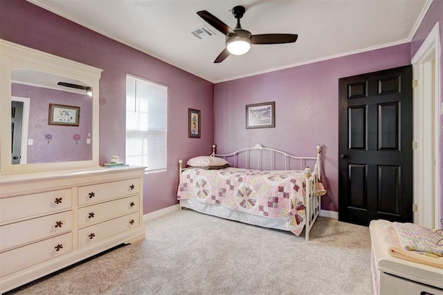 bedroom featuring baseboards, visible vents, crown molding, and carpet flooring