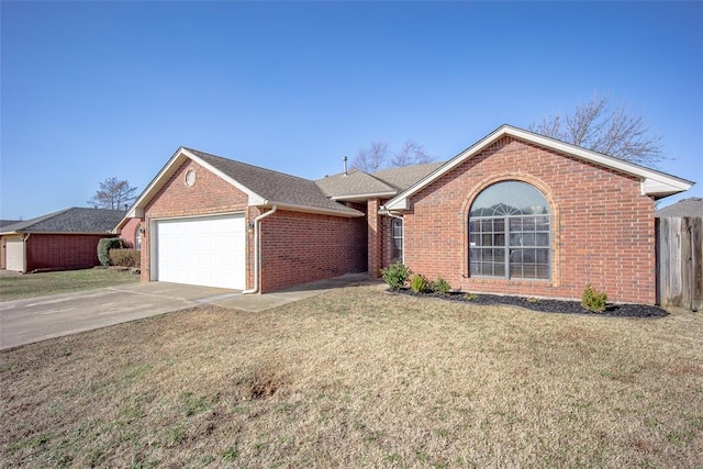 ranch-style home featuring brick siding, roof with shingles, concrete driveway, an attached garage, and a front lawn