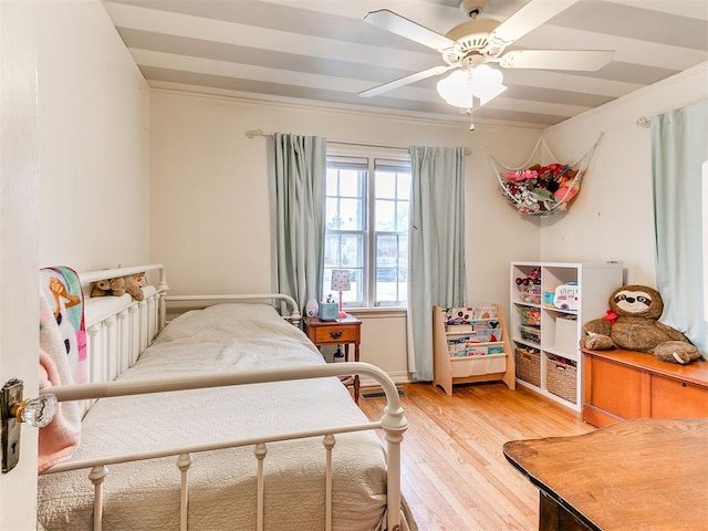 bedroom featuring light wood-style floors and ceiling fan