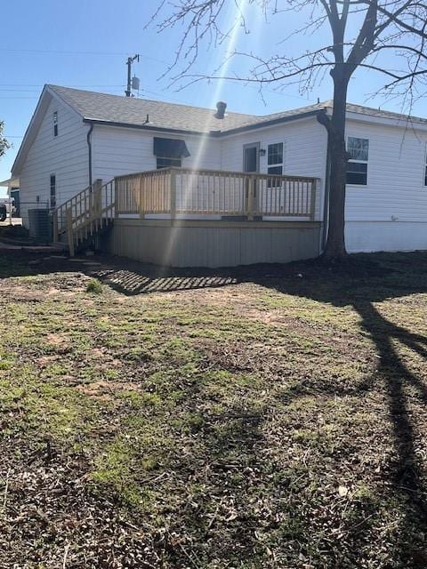 back of property featuring a wooden deck and central air condition unit