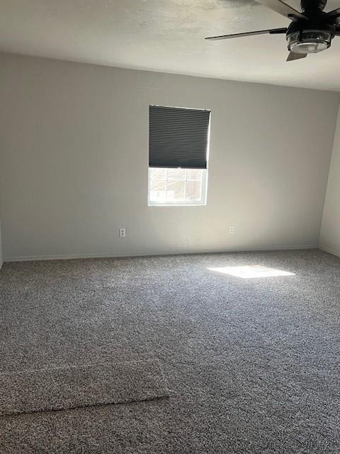 empty room featuring ceiling fan