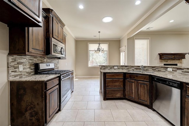 kitchen with crown molding, dark brown cabinetry, light stone counters, appliances with stainless steel finishes, and a sink