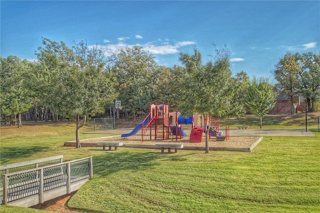 community jungle gym with a yard