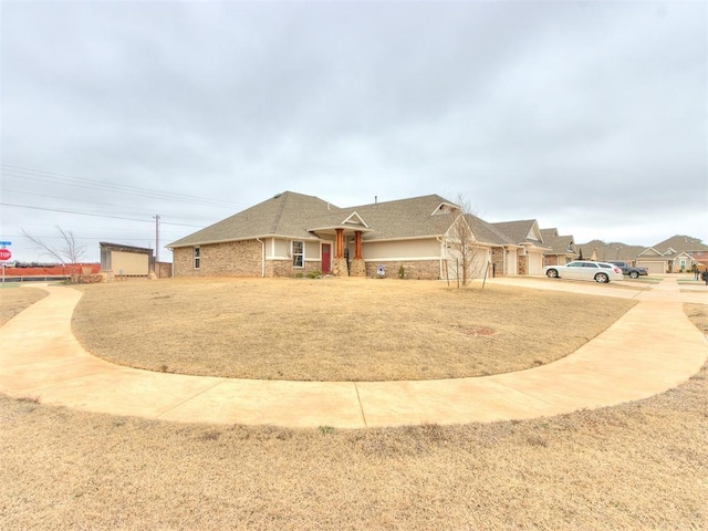 single story home featuring an attached garage and concrete driveway