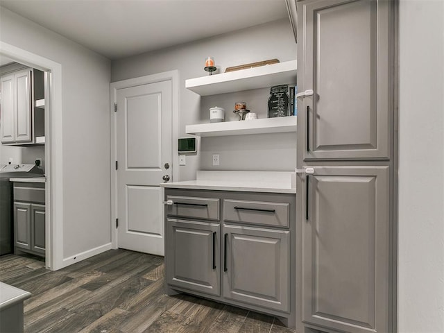 bar featuring dark wood finished floors and baseboards