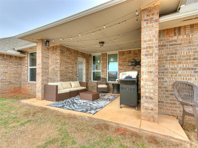 view of patio with grilling area and outdoor lounge area