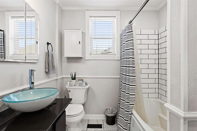 bathroom featuring plenty of natural light, visible vents, and crown molding