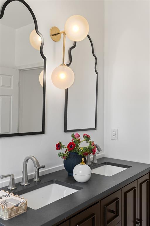 bathroom featuring double vanity and a sink