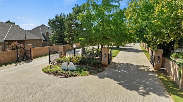 view of road featuring a gated entry and a gate