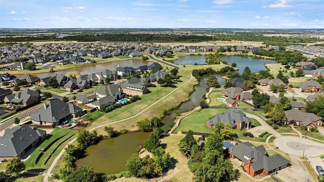 birds eye view of property with a water view and a residential view