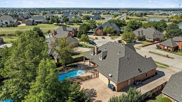 birds eye view of property featuring a residential view and a water view