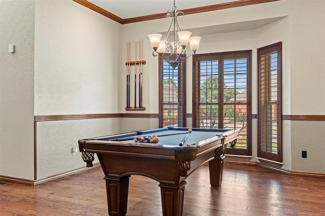 playroom featuring a textured wall, billiards, wood finished floors, baseboards, and crown molding