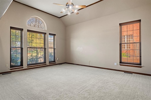 empty room with high vaulted ceiling, baseboards, visible vents, and carpet flooring