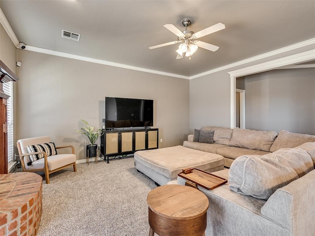 carpeted living room featuring crown molding, visible vents, ceiling fan, and baseboards