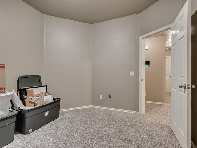 misc room with carpet and baseboards