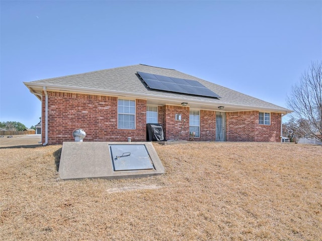 view of storm shelter with a yard