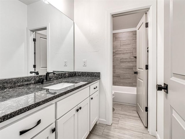 full bath with vanity and toilet