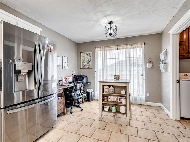 home office featuring a textured ceiling and baseboards